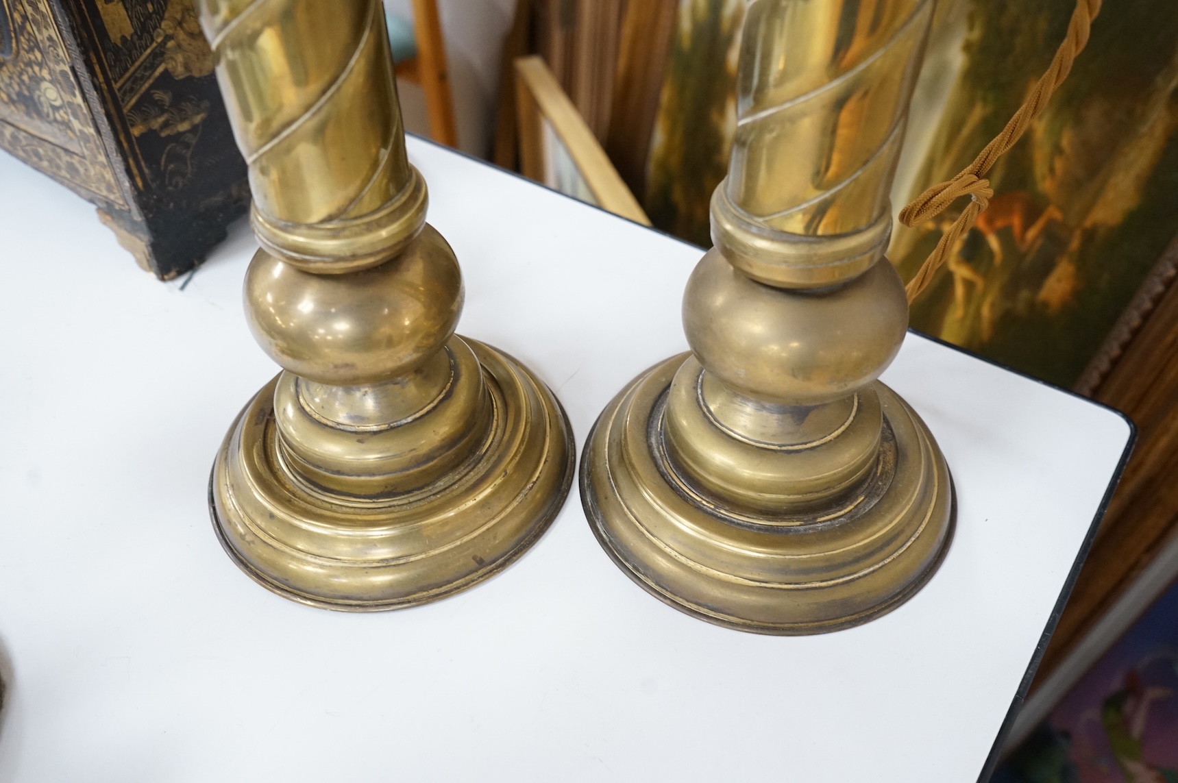 A pair of tall brass fluted column table lamps and arise and fall desk lamp, largest each overall 64cm high